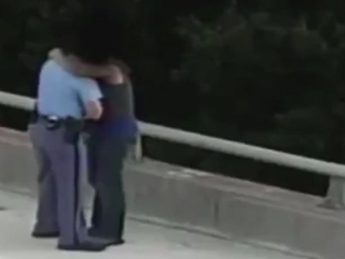 North Carolina police officer talks man off edge of bridge, gives him a hug