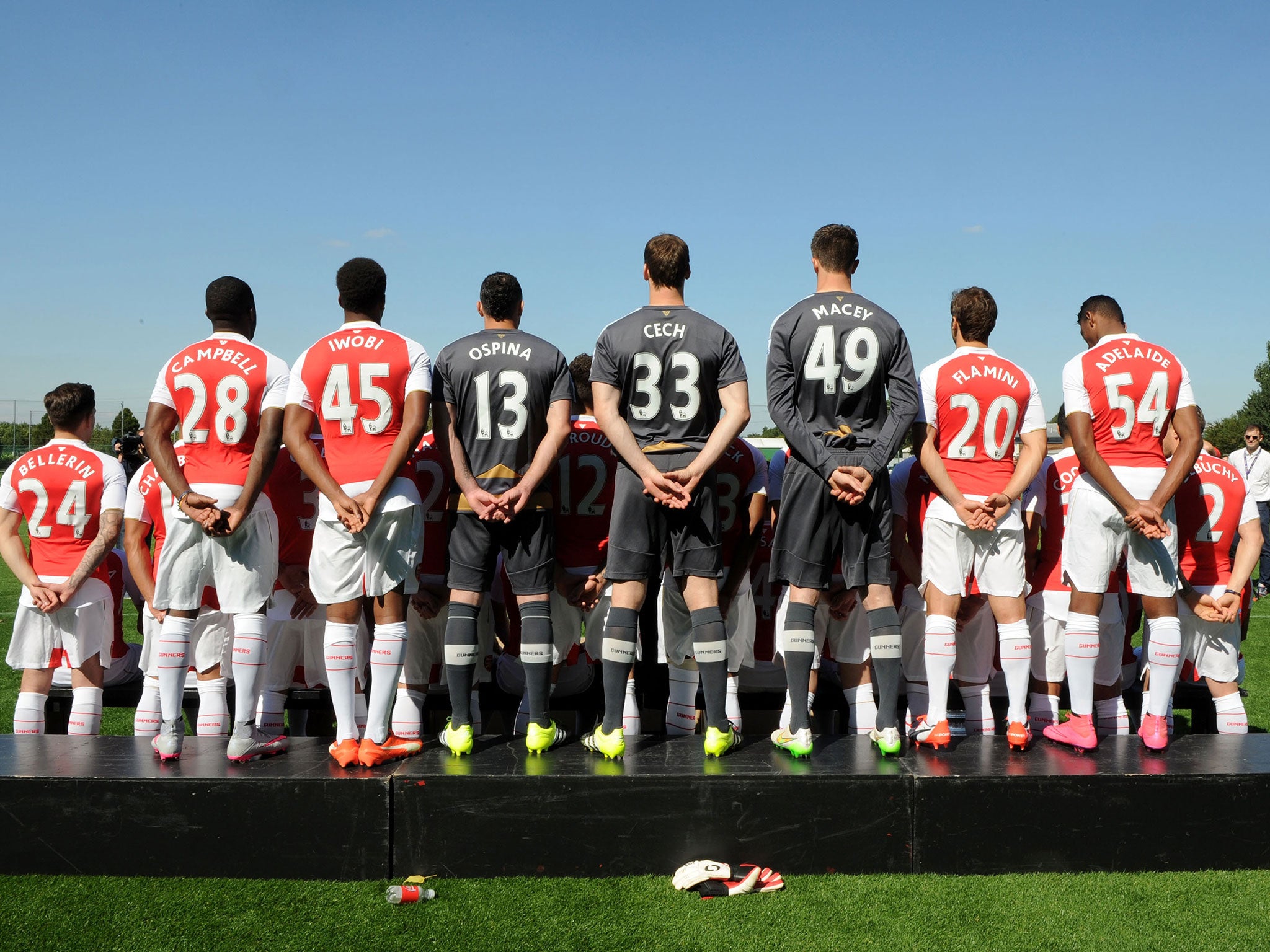 A rear view of Arsenal's three goalkeepers alongside their teammates
