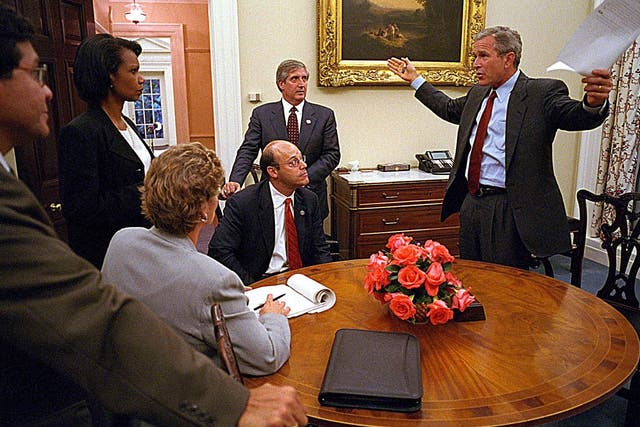 George W Bush addressing staff - including Mr Fleischer (seated) - after finally reaching the White House on September 11  2001