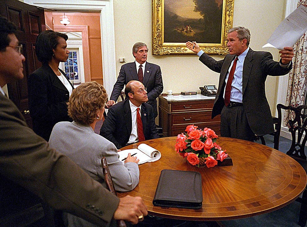 George W Bush addressing staff - including Mr Fleischer (seated) - after finally reaching the White House on September 11  2001