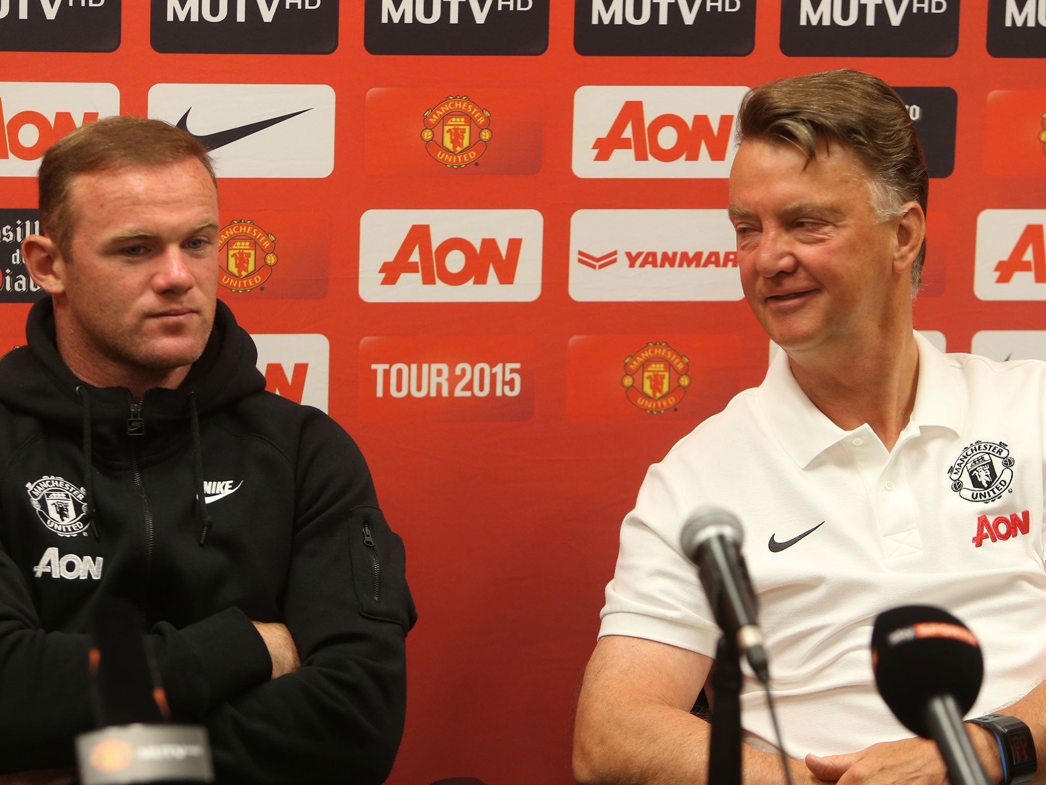 Wayne Rooney at a press conference alongside Louis van Gaal