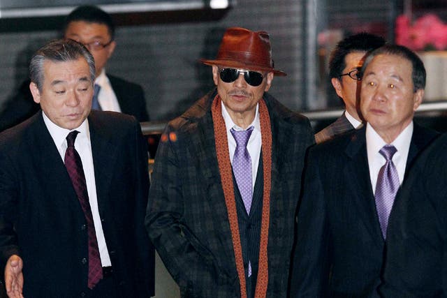 Kenichi Shinoda (centre), the boss of the Yamaguchi-gumi, has tried to improve the mob’s image
