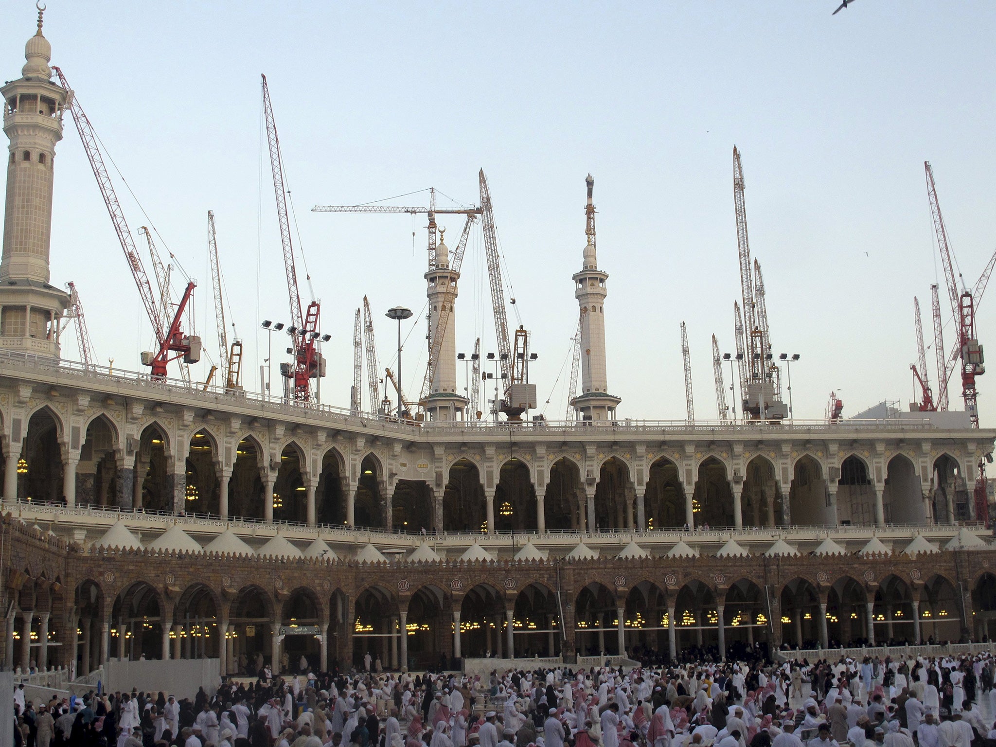 Construction cranes surround the mosque in an image taken from January