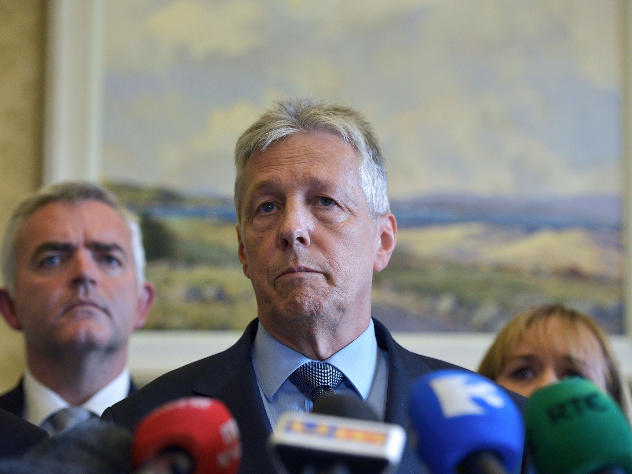 DUP party leader Peter Robinson reacts to questions as he held a press conference announcing he would step down as First Minister on September 10, 2015