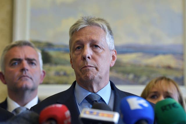 DUP party leader Peter Robinson reacts to questions as he held a press conference announcing he would step down as First Minister on September 10, 2015 