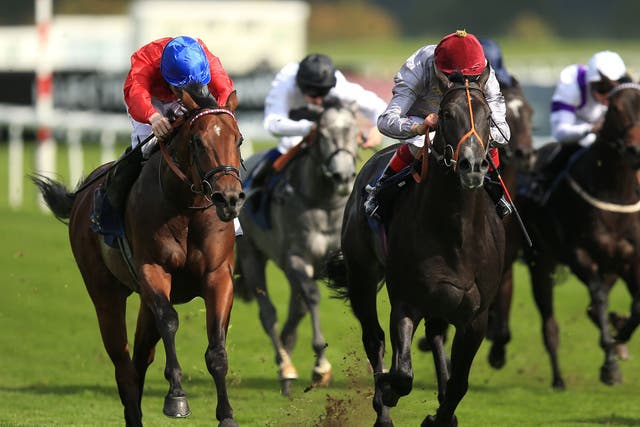 Gutaifan ridden by Frankie Dettori (centre) wins the Flying Childers Stakes at Doncaster yesterday from Ornate