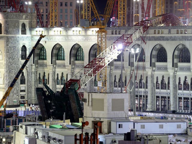 The crane collapsed through a third floor roof of the holy site (AP) 