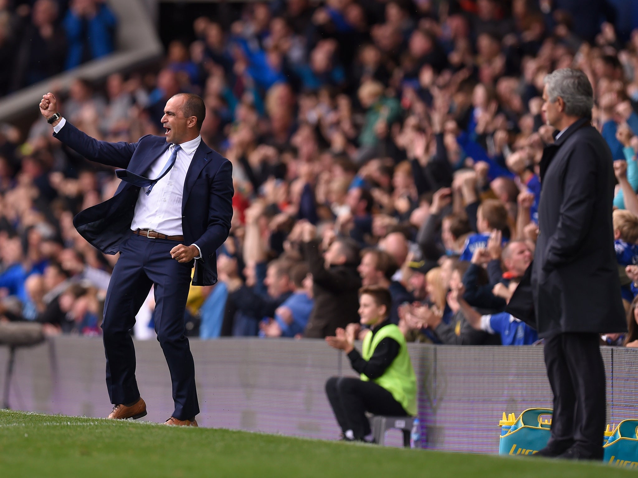 Everton's Roberto Martinez celebrates in front of Chelsea boss Jose Mourinho