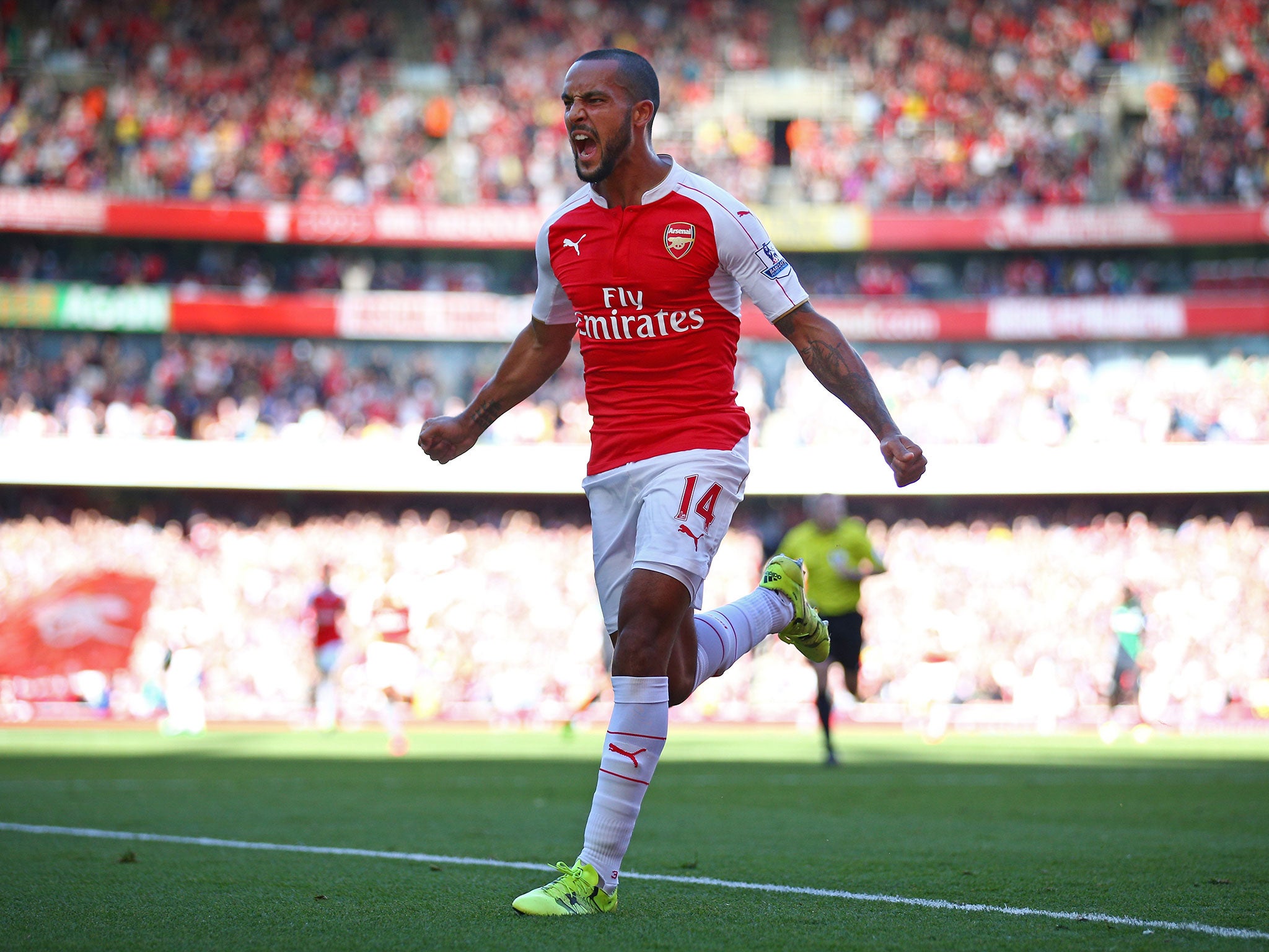 Theo Walcott celebrates scoring against Stoke