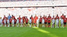 Bayern Munich welcome refugees onto pitch before match