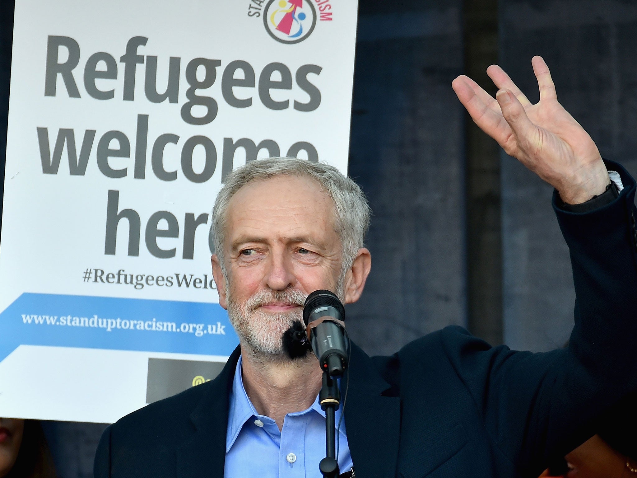 The new leader of the Labour Party Jeremy Corbyn addresses a march in support of refugees in Parliament Square, London