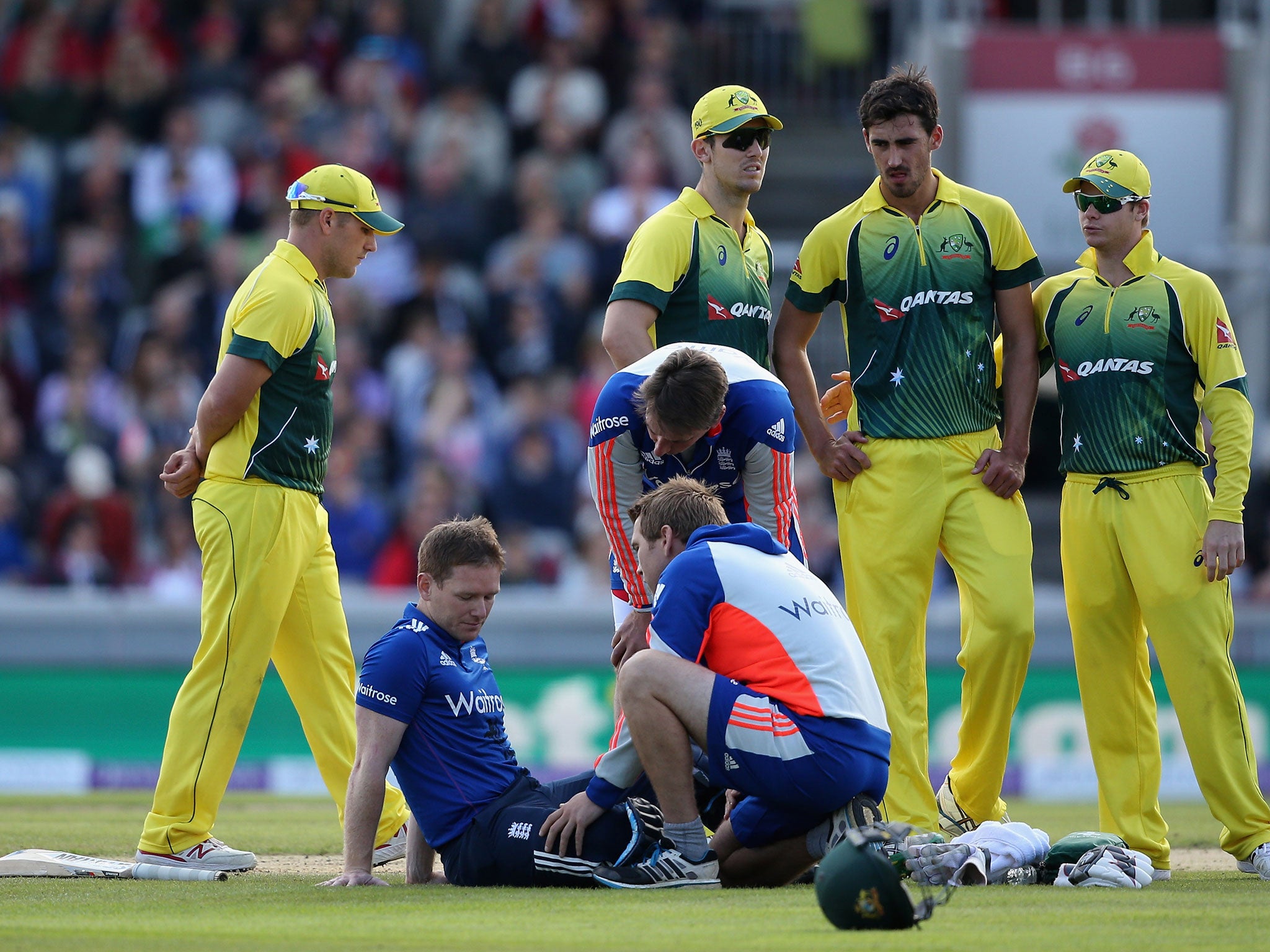 Eoin Morgan receives treatment after taking a ball to the head in the final ODI with Australia
