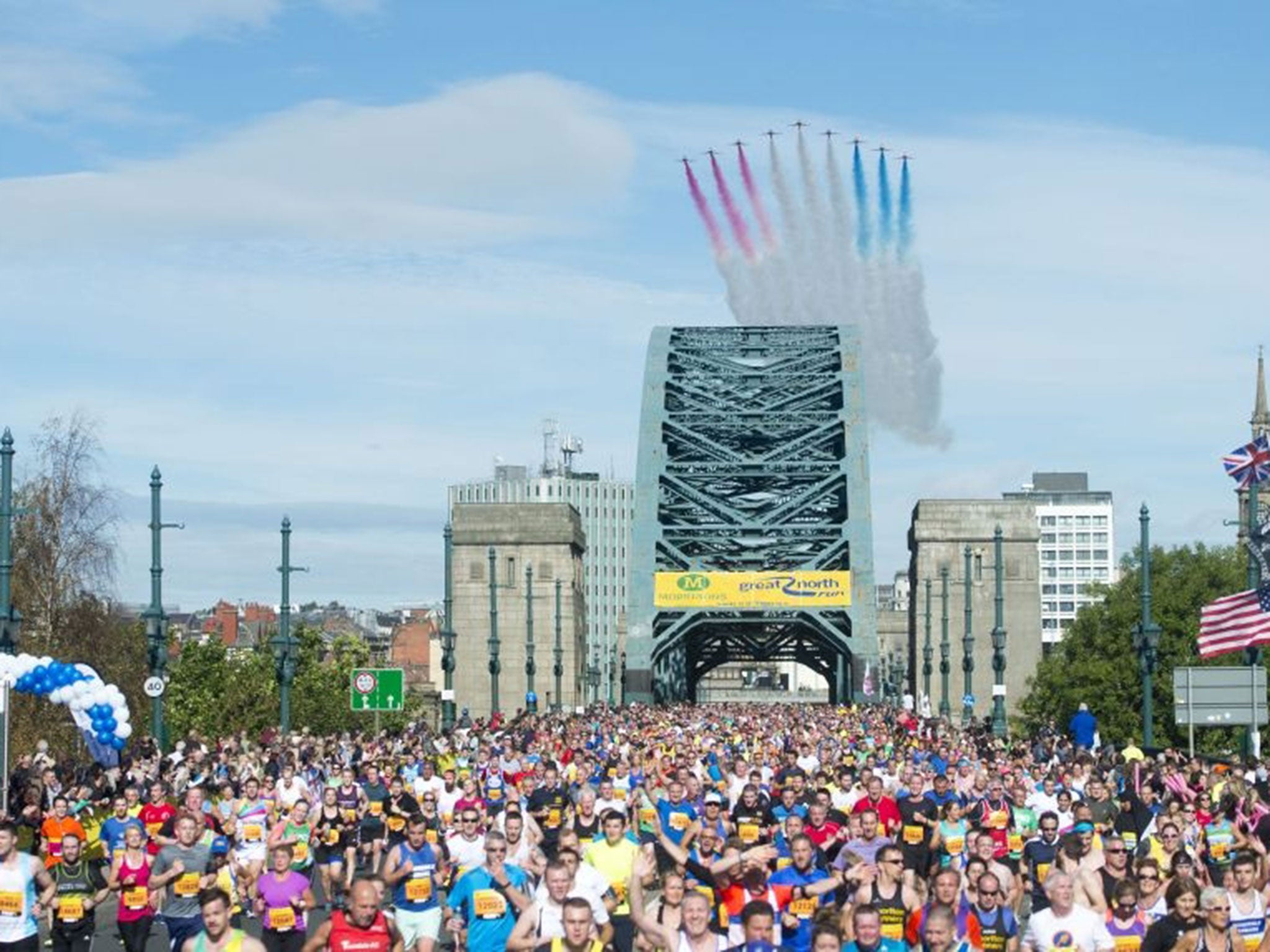 The Red Arrows are seen flying over the Tyne Bridge during the 2015 Morrisons Great North Run, Newcastle. PRESS ASSOCIATION Photo. Picture date: Sunday September 13, 2015.