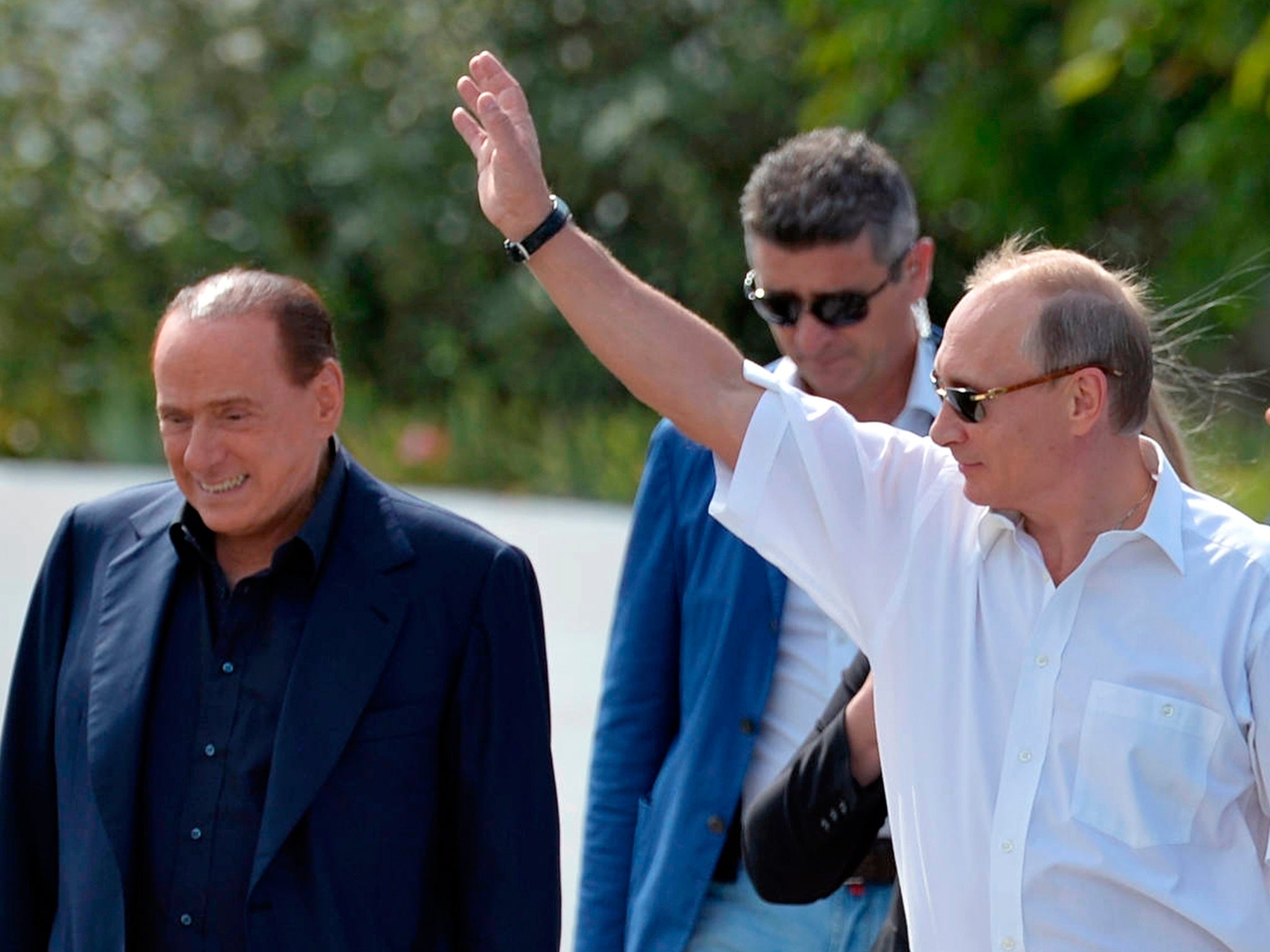 Russian President Vladimir Putin, right, and former Italian Prime Minister Silvio Berlusconi visit the Khan's Palace in the town of Bakhchisarai, Crimea