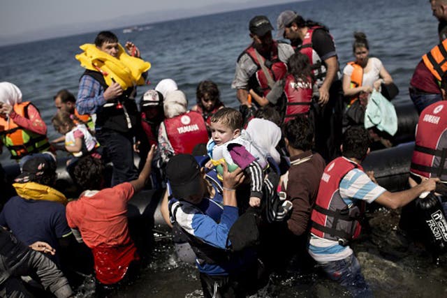 Syrian refugees arrive on the shores of the Greek island of Lesbos on September 11, 2015