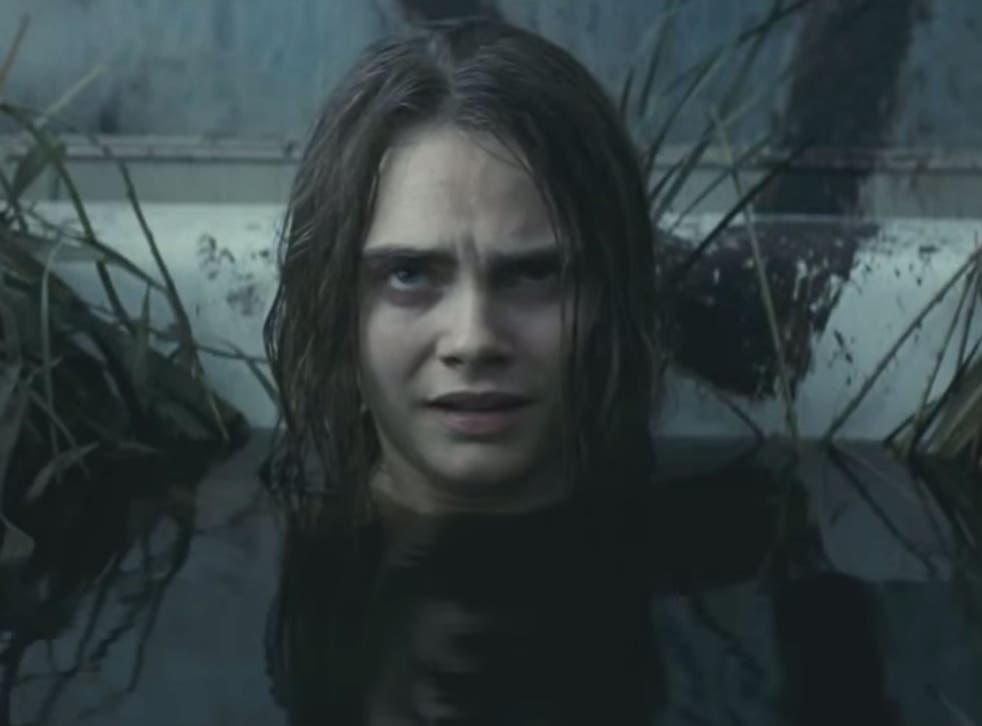 Enchantress is seen bathing in a grim-looking bog in front of a pentagram in the trailer