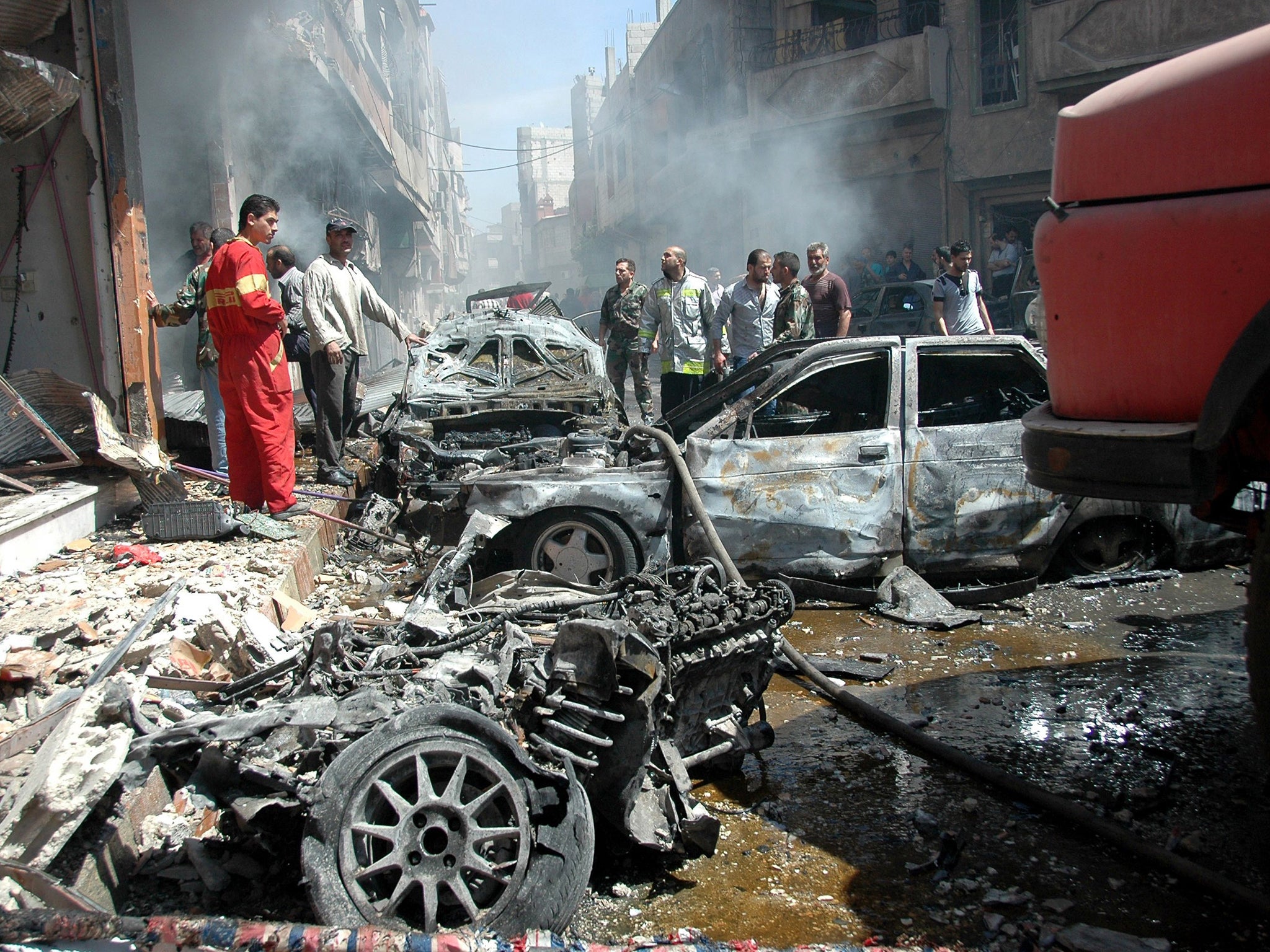 FILE PHOTO: The destruction left when a car bomb ripped through a crowded area of Syria's third city, Homs, last year