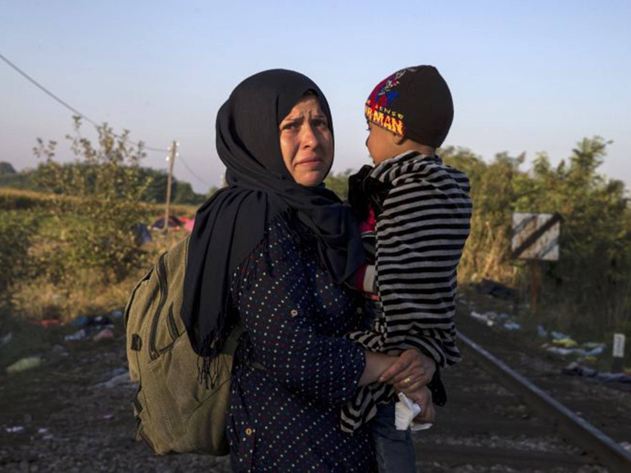 Refugees outside Horgos in Serbia make their way towards the Hungarian border