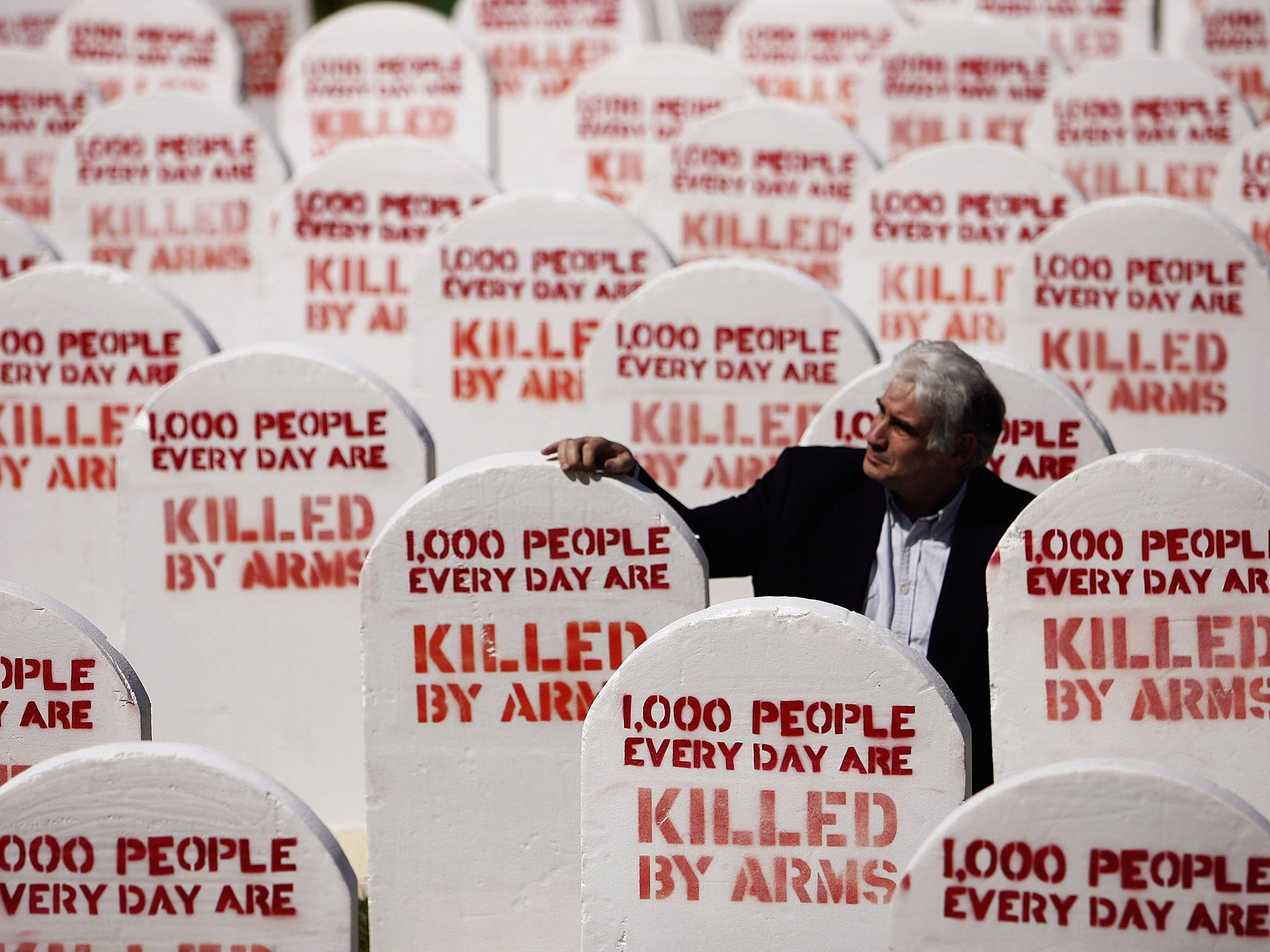 Mick North, who's daughter Sophie was killed in the Dunblane shooting, is seen in a graveyard created by Amnesty International outside the Scottish Parliament in 2006. The gravestones signify the number of people lost to small arms around the world every two hours