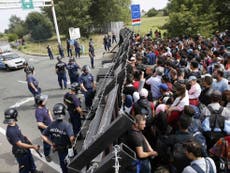 Thousands left stranded after Hungary blocked by razor wire