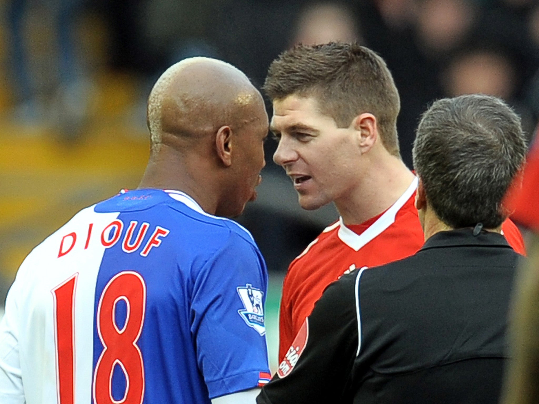 Steven Gerrard and El-Hadji Diouf confront each other during a Liverpool vs Blackburn Rovers match in 2010