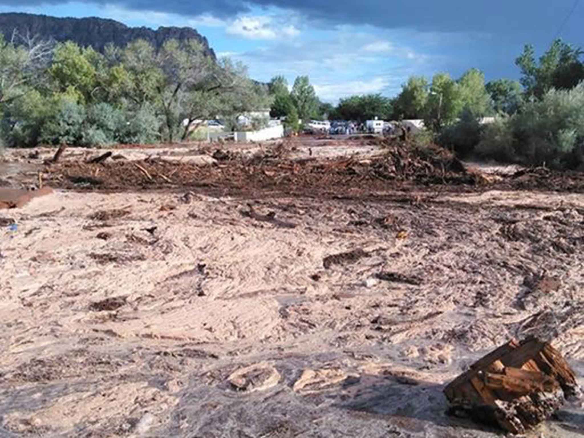 16 people were travelling in a 4x4 and a van when the flood hit