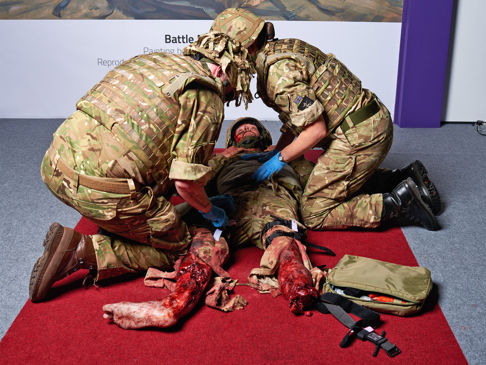 Ashley Samms, receives attention during a 'point of wounding' at the DSEI 2015