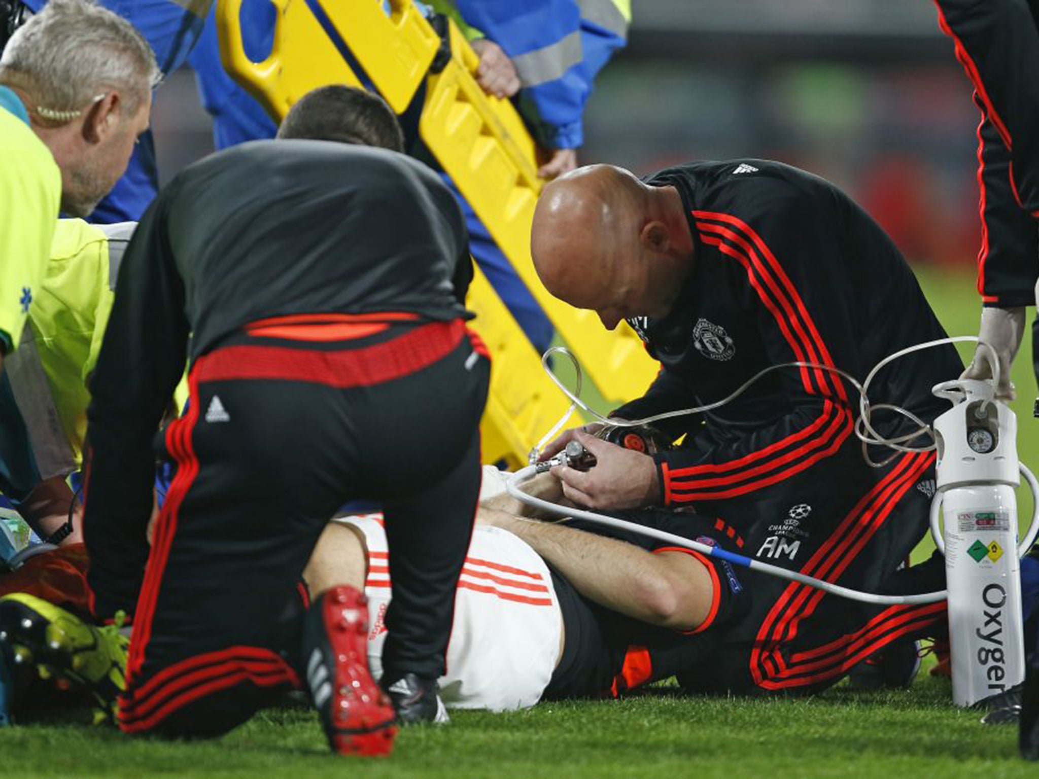 Luke Shaw is treated by Manchester United medics
