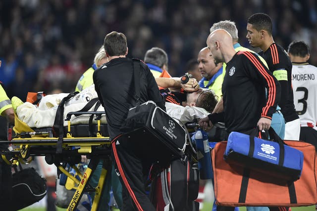 Luke Shaw is carried off the pitch