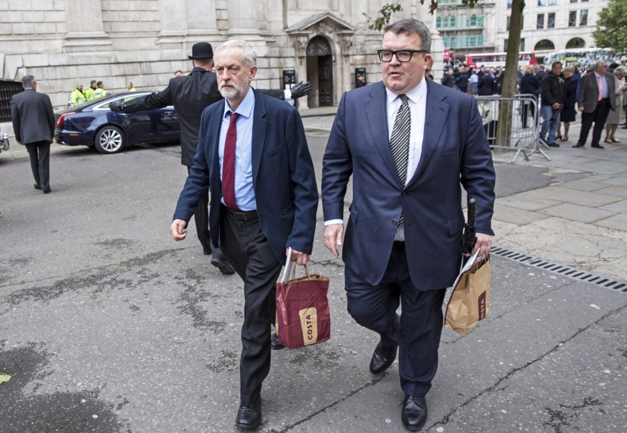 Mr Corbyn and his deputy Tom Watson walking away with a bag of sandwiches