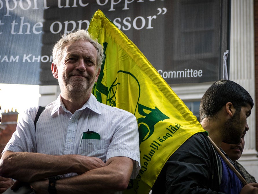 Samuel Hardy caught the moment a man carrying a Hezbollah flag walked behind Jeremy Corbyn at a protest in 2012