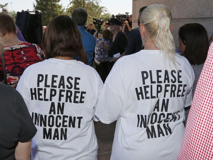 Ericka Glossip-Hodge, left, daughter of Richard Glossip, and Billie Jo Ogden Boyiddle, right, Richard Glossip's sister, listen during a rally to stop the execution of Richard Glossip on 15 September