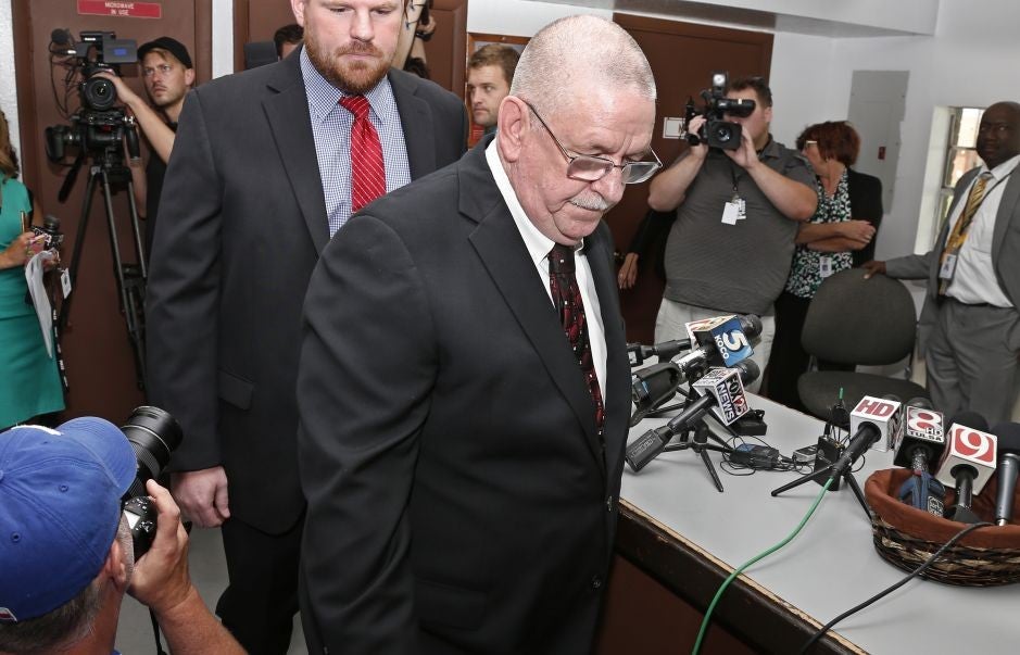 Robert Patton, Director of the Oklahoma Department of Prisons, leaves the press centre after announcing Glossip's stay of execution (AP)