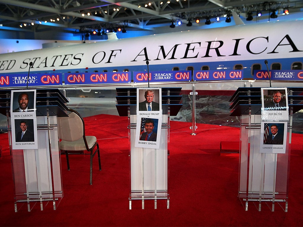Candidate photos are displayed on podiums before the start of the CNN Republican Presidential Debate, in Simi Valley, California