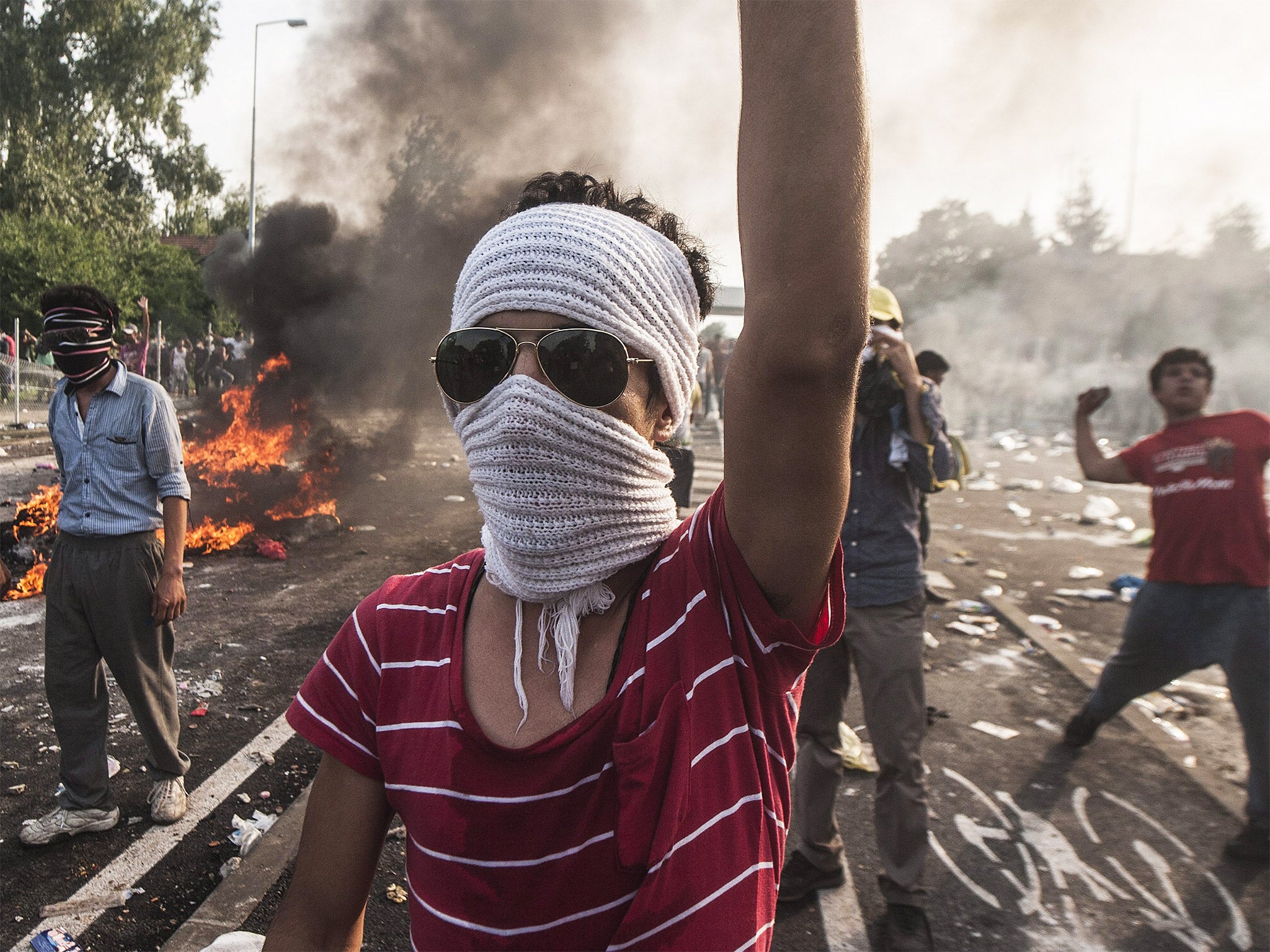 Hungarian police fired tear gas into the crowd at the border near Horgos, Serbia