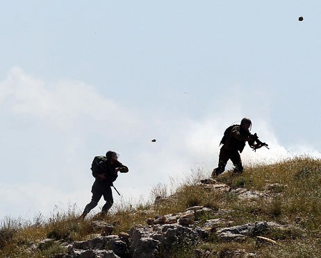 Israeli soldiers being pelleted with rocks