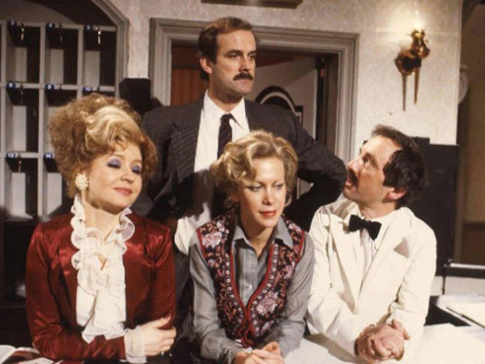 Towering achievement: John Cleese as Basil Fawlty, Prunella Scales as Sybil, Connie Booth as Polly and Andrew Sachs as Manuel 