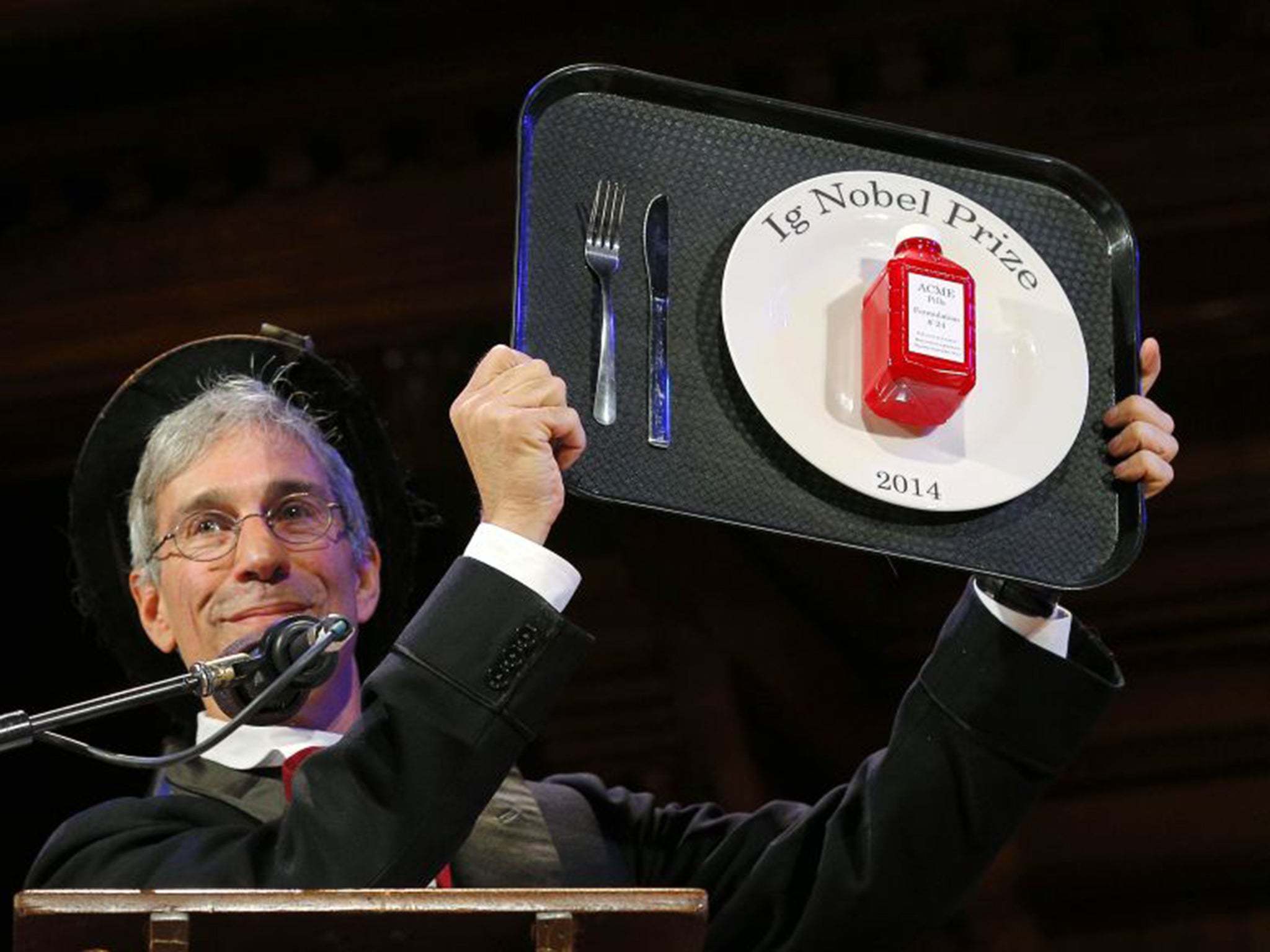 Marc Abrahams, Master of Ceremonies and editor of the Annals of Improbable Research, holds one of this year's prizes at the 24th Ig Nobel Prizes awards ceremony last year