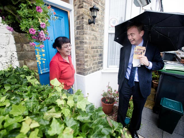 Tim Farron MP, leader of the Liberal Democrats, canvassing in the rain in Wood Green ahead of Thursday’s Woodside by-election
