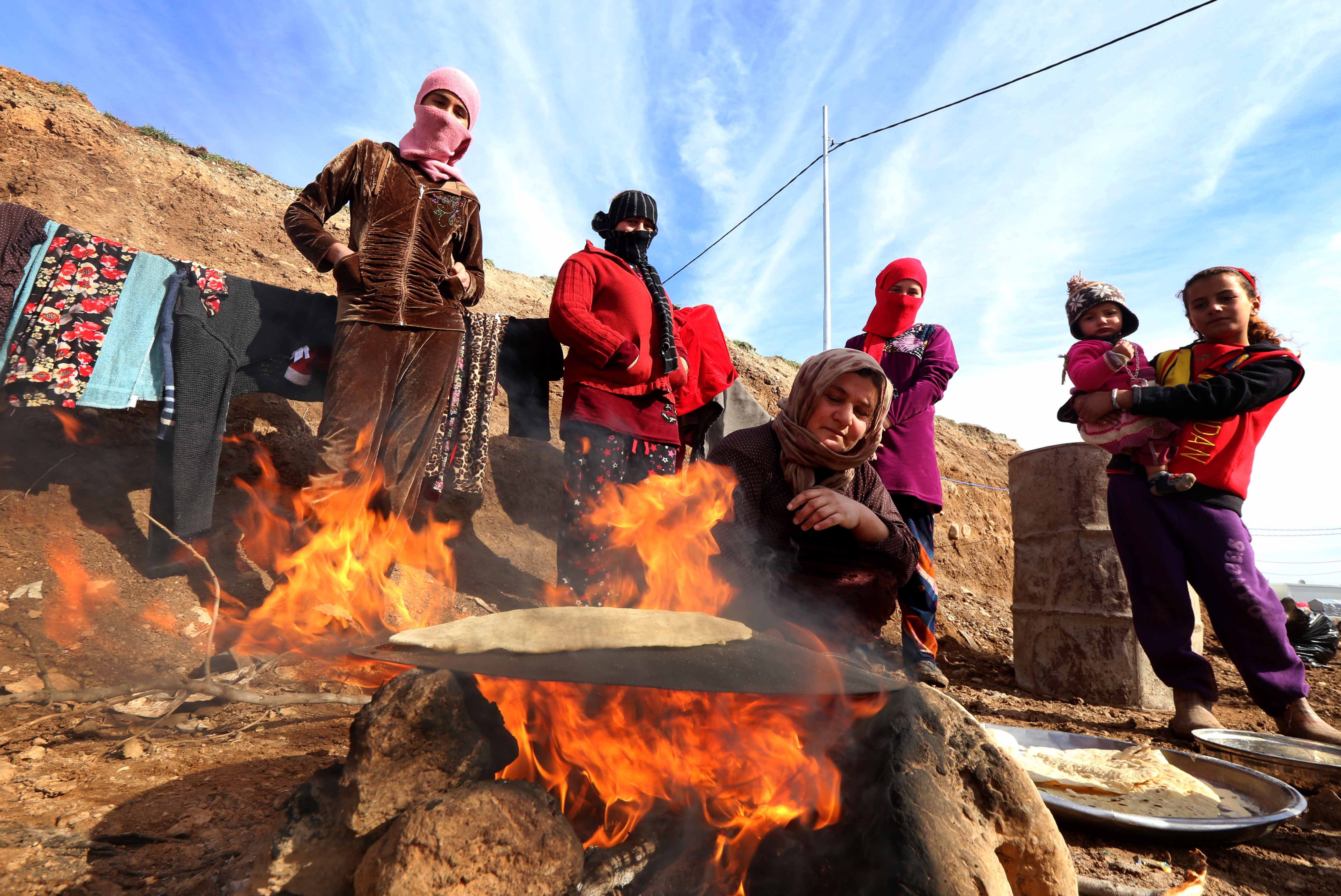 Displaced Iraqis from the Yazidi community, who fled violence between Islamic State (IS) group jihadists and Peshmerga fighters