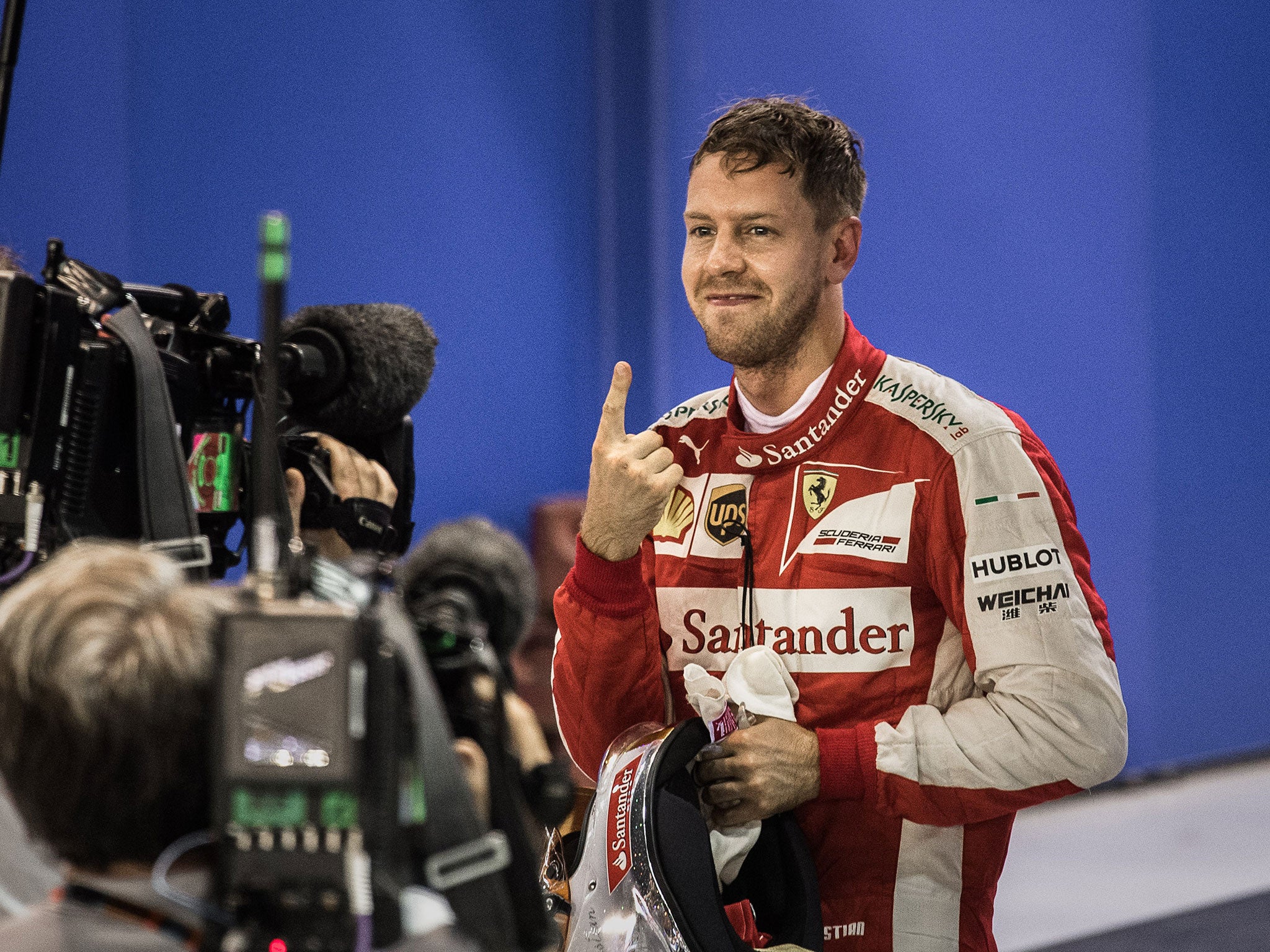 Sebastian Vettel celebrates taking pole in Singapore