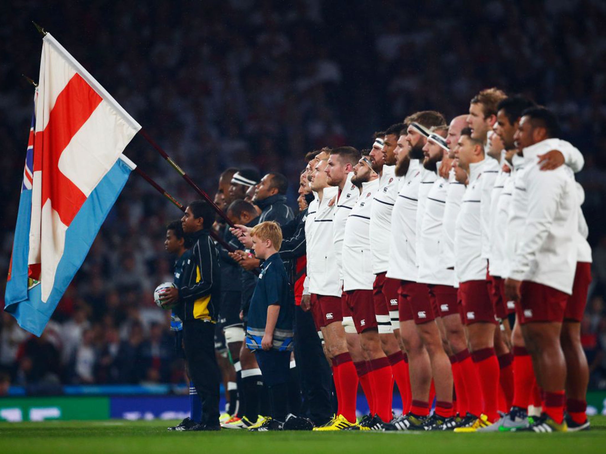 The England rugby union team singing the national anthem ahead of their opening World Cup match against Fiji on Friday