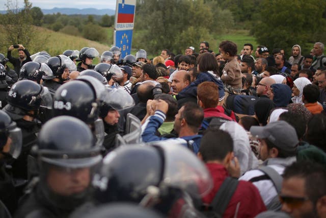 Refugees face police in Croatia where demonstrations turned ugly after some plastic bottles were thrown at the police, who responded by firing pepper spray into the crowd