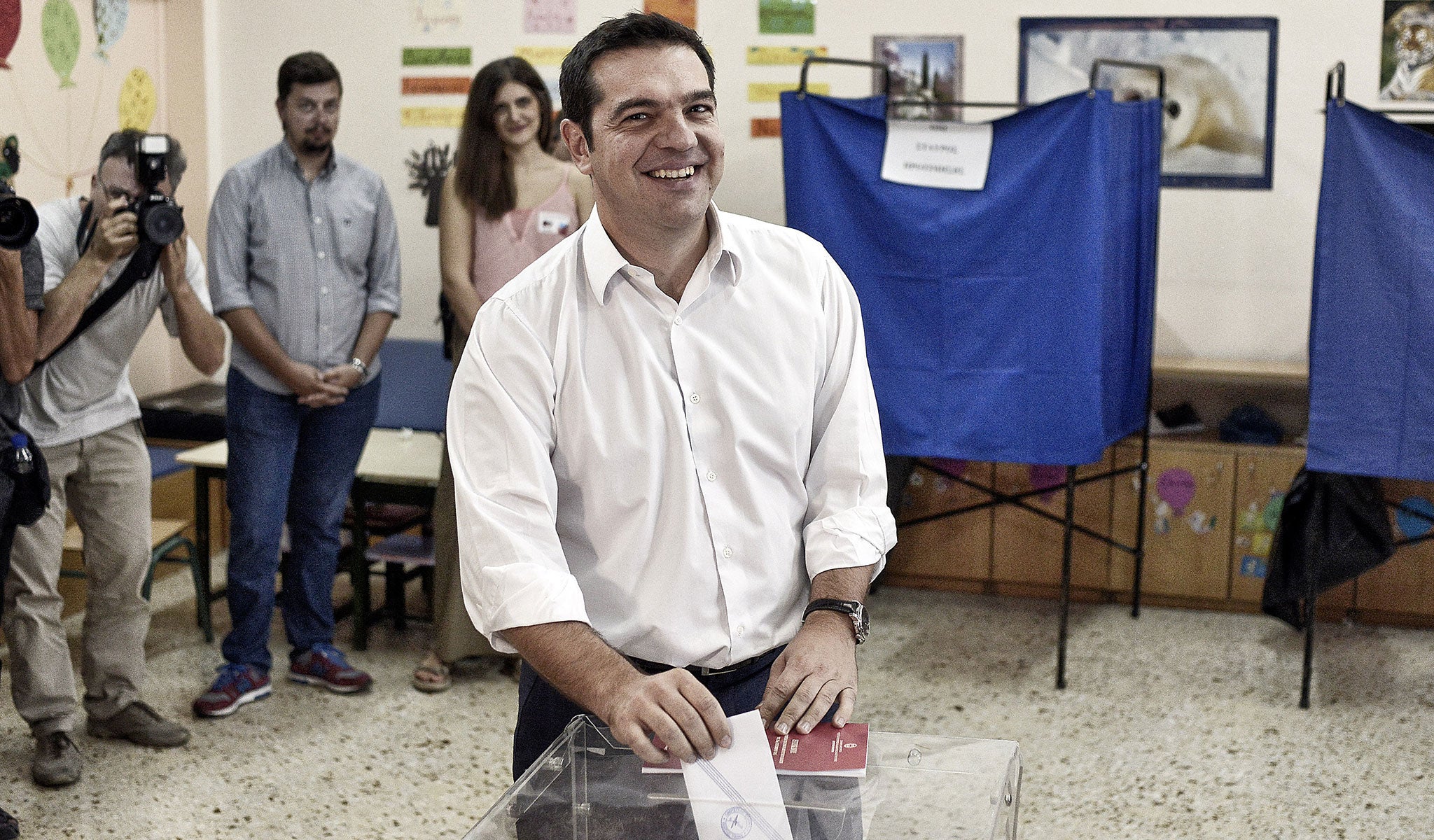 The leader of Greece's left-wing Syriza party Alexis Tsipras casts his ballot at a polling station on September 20, 2015 in Athens, Greece