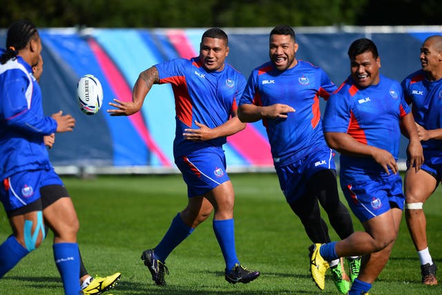 Samoa warming up for their Group B clash with USA in Brighton