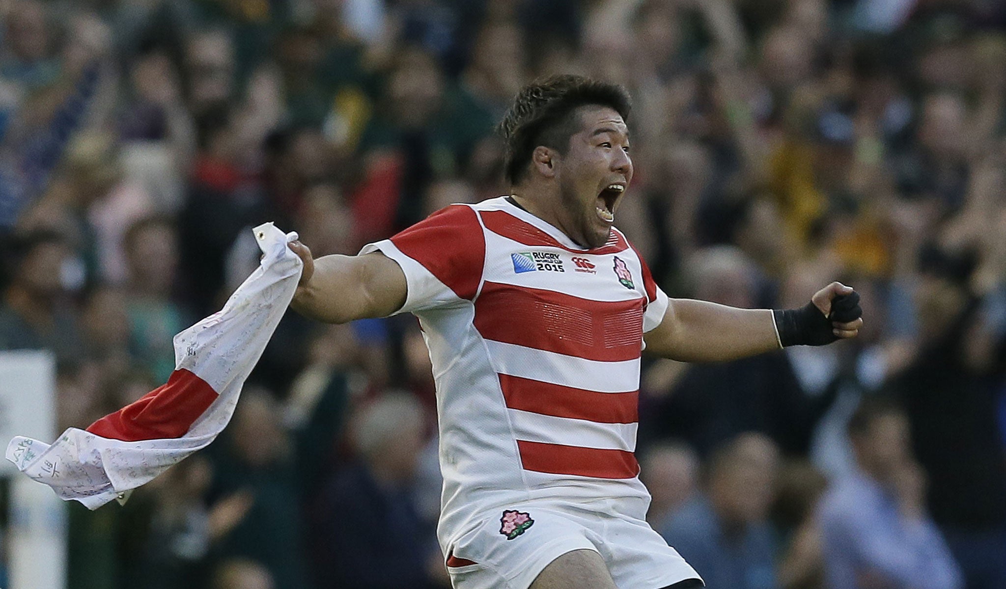 Japan's Kensuke Hatakeyama celebrates victory in the Rugby World Cup Pool B match between South Africa and Japan