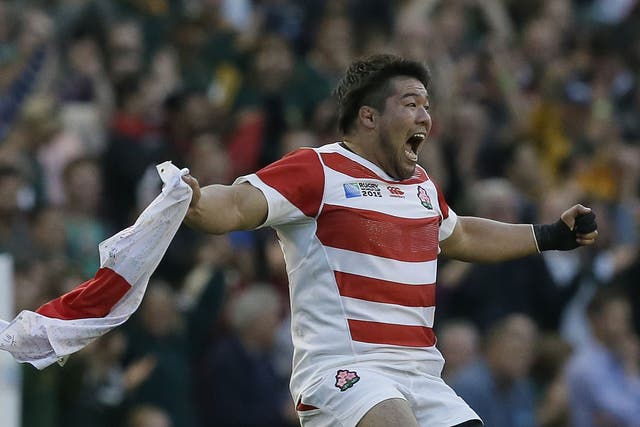 Japan's Kensuke Hatakeyama celebrates victory in the Rugby World Cup Pool B match between South Africa and Japan