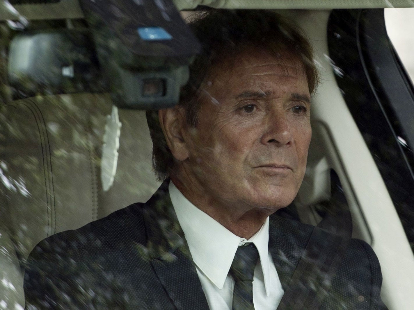 Cliff Richard leaves the church after the funeral of Cilla Black