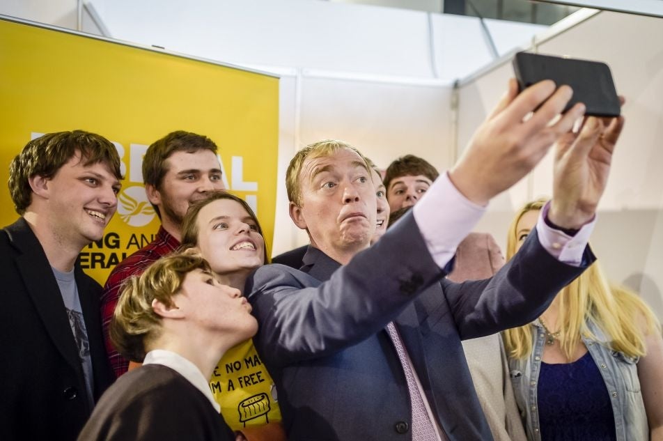 Liberal Democrats leader Tim Farron poses for a selfie during his walkabout at the Liberal Democrats annual conference, Bournemouth International Centre.