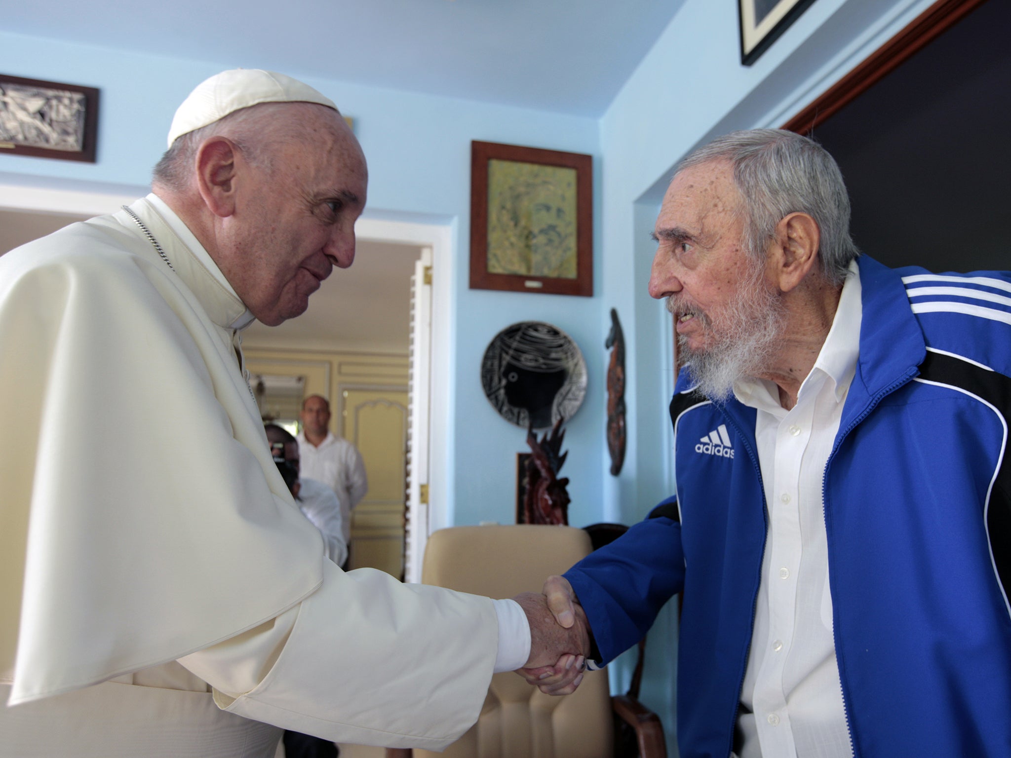 Pope Francis and Cuba's Fidel Castro shakes hands, in Havana, Cuba. The Vatican described the 40-minute meeting at Castro's residence as informal and familial, with an exchange of books